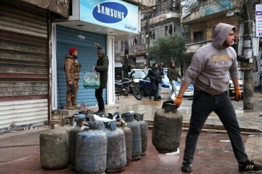 Syria's government was in full control of the two Kurdish-majority areas of Aleppo by Sunday morning