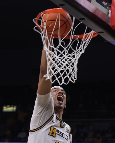 Mizzou guard Trent Pierce (11) dunks the basketball (copy)