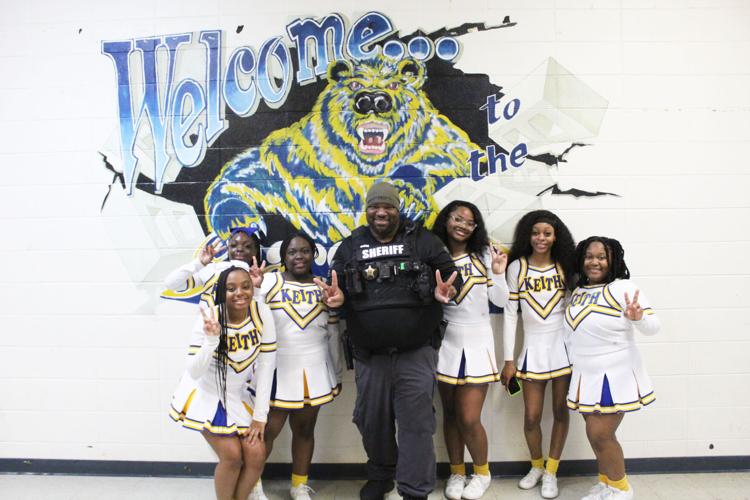 Weems with cheerleaders