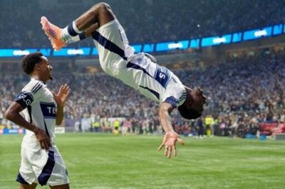 Vancouver's Emmanuel Sabbi celebrates scoring for the Whitecaps, who defeated Los Angeles FC in a shootout to advance to in the MLS Cup playoffs