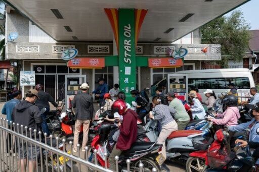 Motorists queue at a petrol station in Luang Prabang, Laos, following import disruptions caused by the Middle East war