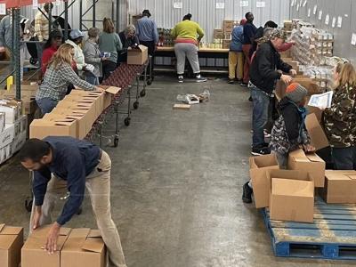 Food Bank handles flood of food as it prepares to serve after donations move on to next disaster