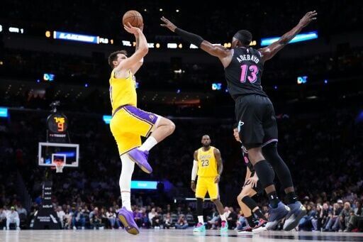 Los Angeles Lakers star Luka Doncic takes a shot over Bam Adebayo in the Lakers' NBA victory over the Miami Heat
