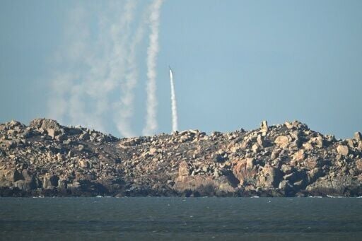 Chinese People's Liberation Army (PLA) soldiers fire a rocket into the air as they conduct military drills on Pingtan island, in eastern China's Fujian province, the closest point to Taiwan, on December 30, 2025