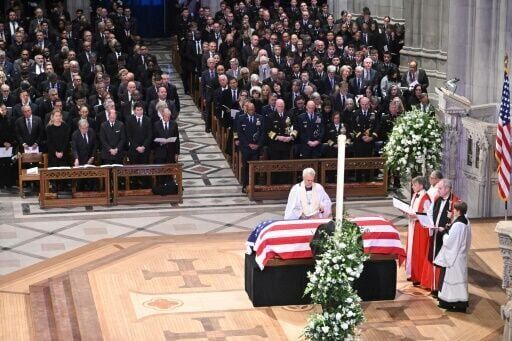 Jimmy Carter briefly unites US as presidents attend funeral