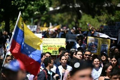 University students who oppose the Venezuelan government march on Youth Day in Caracas on February 12, 2026