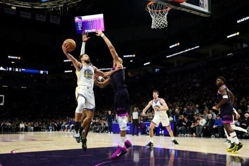 Golden State star Stephen Curry rises for a shot against Rudy Gobert in the Warriors' NBA victory over the Minnesota Timberwolves