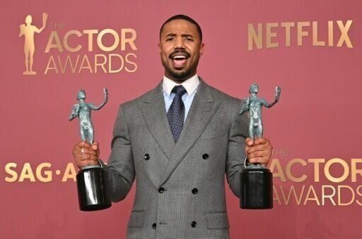 'Sinners' star Michael B. Jordan poses with his two Actor Awards -- for best cast and best male actor