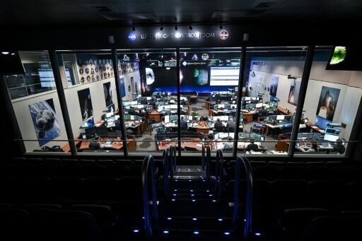 Artemis II flight controllers monitor the Orion spacecraft from the White Flight Control Room at Johnson Space Center in Houston, Texas, on April 6, 2026