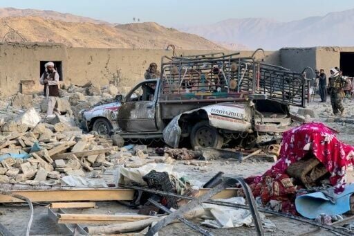 Afghan men search for victims after a Pakistani air strike hit Girdi Kas village, in Bihsud district of Nangarhar province