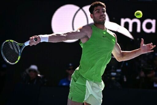 World number one Carlos Alcaraz hits a return during his win over Germany's Yannick Hanfmann