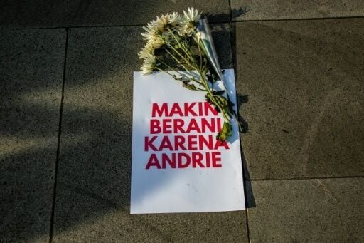 A poster reading 'Braver because of Andrie' at a demonstration in support of activist Andrie Yunus, targeted in an acid attack
