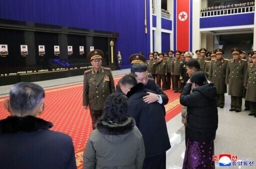 A picture released by North Korea's official Korean Central News Agency (KCNA) showing North Korean leader Kim Jong Un meeting with relatives of fallen North Korean soldiers, killed during their overseas deployment in Russia's Kursk region