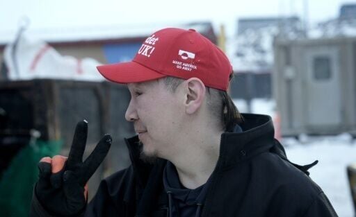 Greenlander Aqqalu Petersen wears his 'Make America Go Away' hat with pride