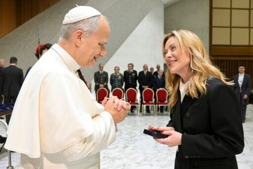 Prime Miniser Giorgia Meloni, pictured here in a Vatican photo meeting Pope Leo XIV in early January, joked online that she does not 'resemble an angel'