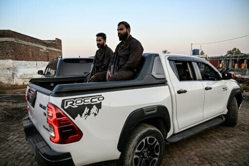Imposing pickup trucks symbolise Pakistan's power gulf