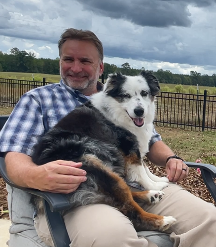 Chuck Sykes with dog Sid