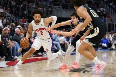 Cade Cunningham of the Detroit Pistons drives during an NBA game against the Milwaukee Bucks