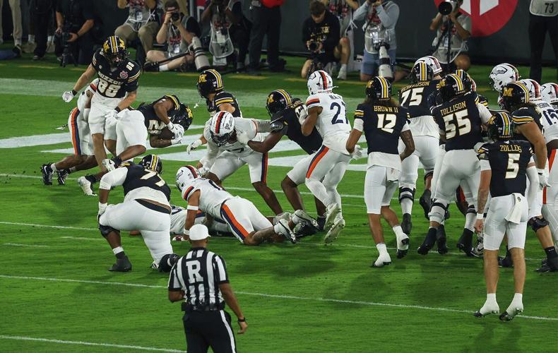 Mizzou running back Jamal Roberts (20) scores a touchdown