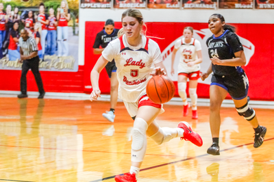 Aerynn Huntsman takes ball up court in fastbreak.png