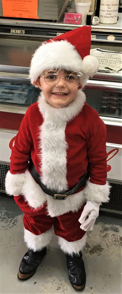 Tiny Santa brings gifts to Gabe's Corner in Valley Grande on Christmas Eve