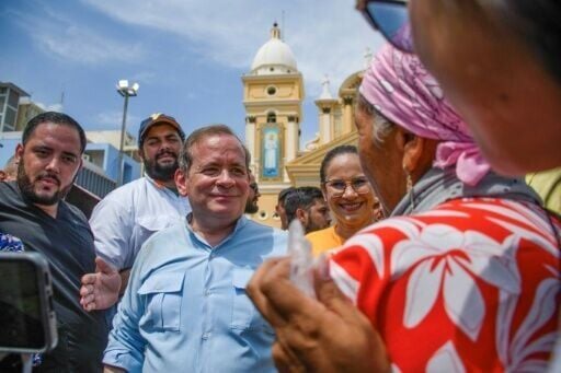 Venezuelan opposition figure Juan Pablo Guanipa greets supporters outside the Basilica of the Virgin of La Chinita in Maracaibo