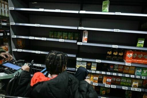 Shoppers browse near empty shelves as Washington dC residents stock up on supplies ahead of massive winter storm set to blanket much of the continental US