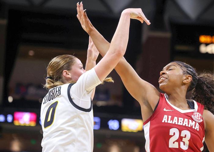 Mizzou guard Grace Slaughter (0) shoots the ball over Alabama guard Jessica Timmons