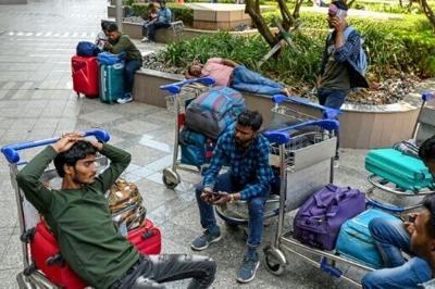 Stranded passengers wait at the departure terminal in Mumbai on March 1, 2026 after India's two largest private carriers IndiGo and Air India suspended flights to all destinations in the Middle East