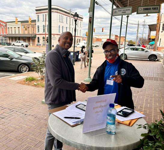 Perry Varner  Juvenile Detention Center Liaison Cedric Wherry signed up to be a part of the Selma Walking Club during Justin Rudolph’s sign up campaign at Reflections.JPG