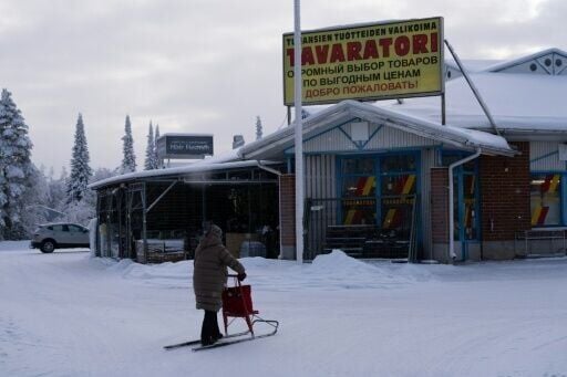 A local gets about in Tohmajarvi on a 'spark' kicksled