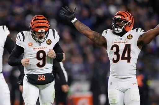 Joe Burrow and Samaje Perine of the Cincinnati Bengals celebrate a touchdown in an NFL victory over the Baltimore Ravens