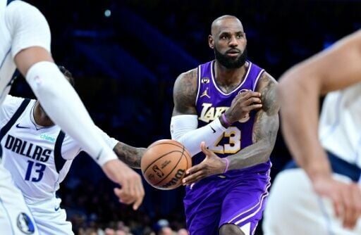 Los Angeles superstar LeBron James throws a no-look pass in the Lakers' NBA win over the Dallas Mavericks