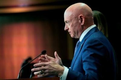 Democratic Senator Mark Kelly speaks during a news conference at the US Capitol on February 11, 2026