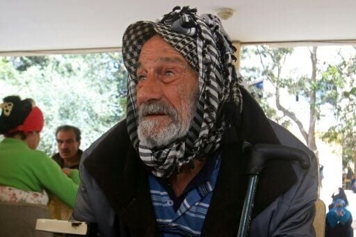 A man from southern Lebanon takes shelter at a school in Sidon