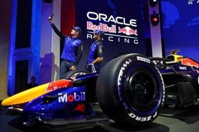 Red Bull drivers Isack Hadjar and Max Verstappen snap a selfie at te unveiling of the team's car for the 2026 Formula One season