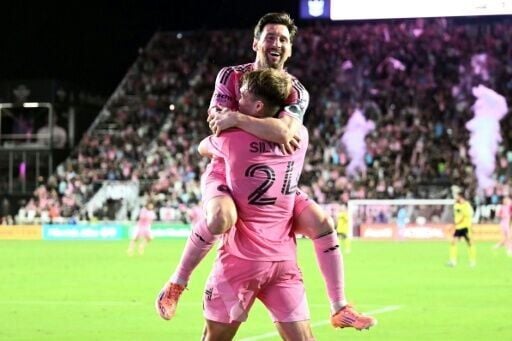 Inter Miami's Argentine star forward Lionel Messi celebrates scoring his second goal with teen countryman Mateo Silvetti, front, in an MLS playoff victory over Nashville that advanced Miami to the second round
