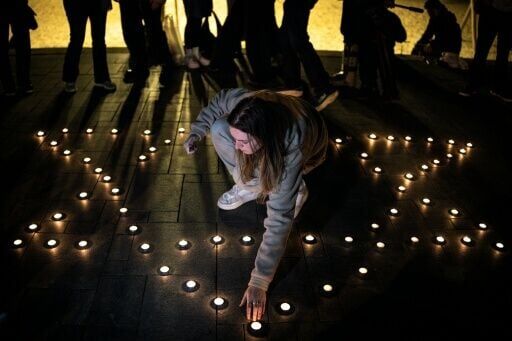 Hours after the shooting in Bondi Beach, a candlelight vigil was held on a beach in Tel Aviv where mourners lit candles