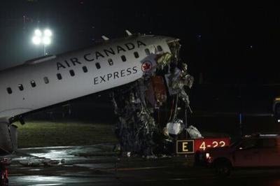 An Air Canada Express CRJ-900 sits on the runway after colliding with a Port Authority fire truck at LaGuardia Airport in New York, on March 23, 2026. Air Canada Express flight AC8646 originated from Montreal and collided with the fire truck during landing