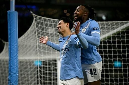 Manchester City's Tijjani Reijnders and Antoine Semenyo (R)