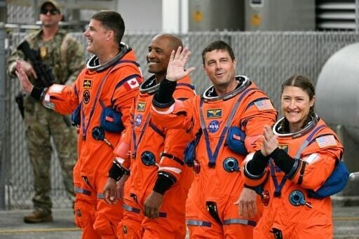 From left: Jeremy Hansen, Victor Glover, Reid Wiseman and Christina Koch heading toward the launch pad on Wednesday