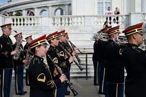 Trump flexes military might at parade as protests sweep US