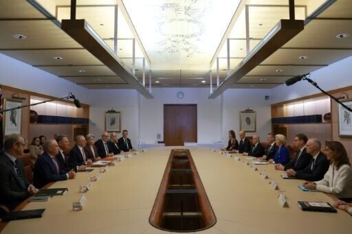 Australian Prime Minister Anthony Albanese (4th left) holds talks with European Commission President Ursula von der Leyen (4th R) alongside their respective aides at Parliament House in Canberra on March 24, 2026