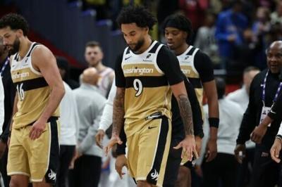 Washington's Justin Champagnie walks away after a fight that led to his ejection from the game and a one-game ban imposed by the NBA for the incident