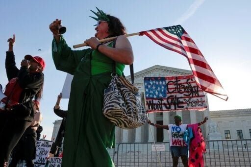Demonstrators outside the US Supreme Court ahead of oral arguments in the birthright case