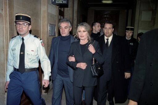 Brigitte Bardot and her fourth husband Bernard D'Ormale leave a Paris court in 1997