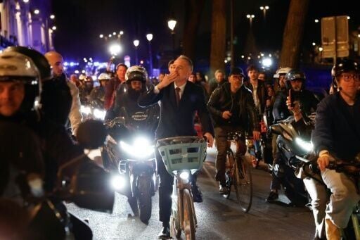 Socialist candidate Emmanuel Gregoire hopped on one of Paris's iconic rental bikes to head to city hall