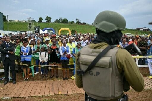 A Cameroonian soldier stands guard as the pope leads mass at Bamenda Airport