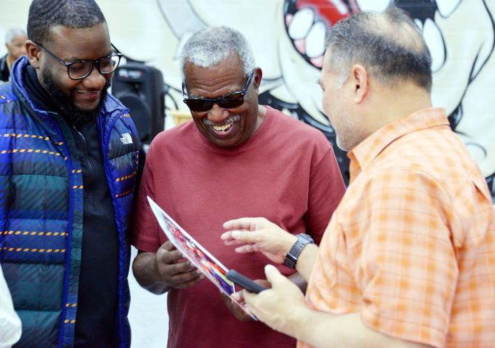 Bobby Thomas shows where he is in 1965 photo