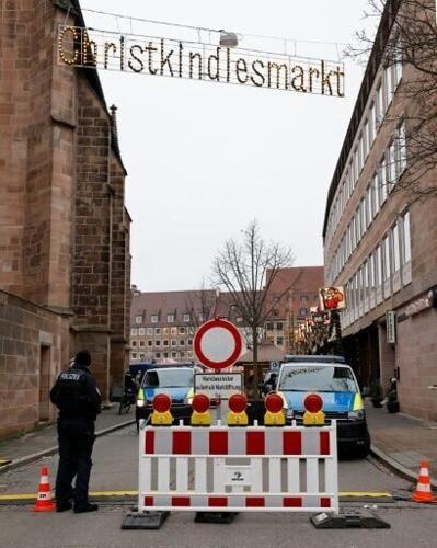 German police guard a street leading to the Christmas market in Nuremberg